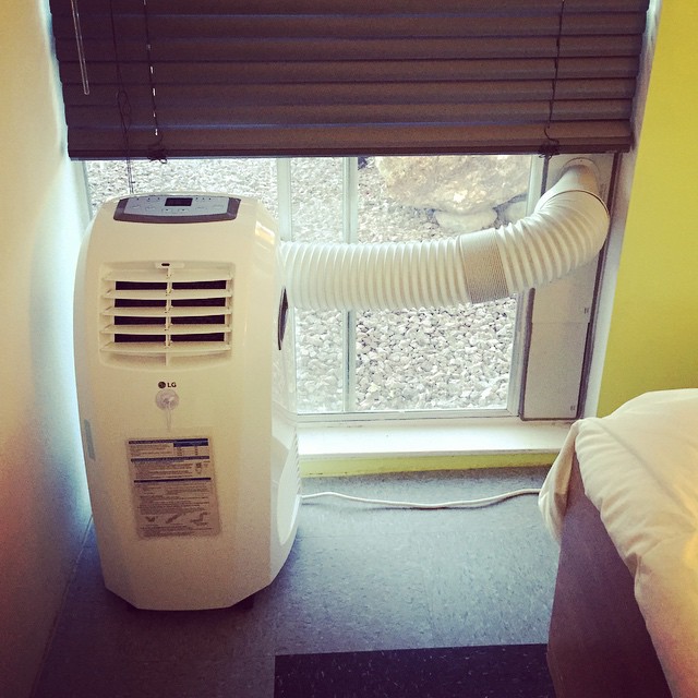 A portable air conditioner used to represent the concept of how to vent a portable air conditioner without a window.