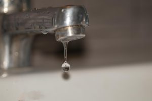A leaky faucet that could use a plumbing inspection